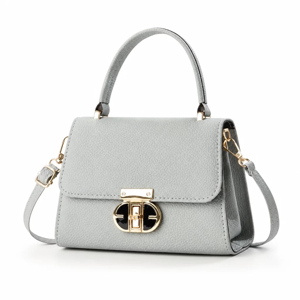 Clean studio product photo of a light grey handbag
